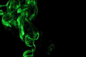 Obraz premium Green smoke on black background