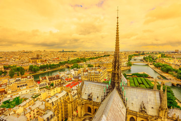 Panoramic aerial view of the spire of Notre Dame cathedral with statues, in Paris city capital of...