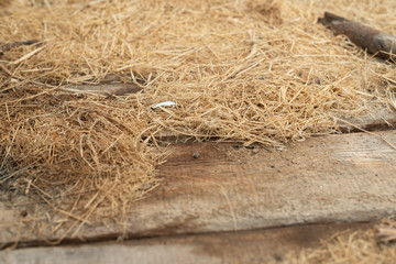 Background and texture of old dry grass hay on wooden background