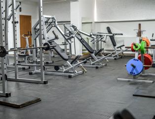 Fototapeta na wymiar Modern interior of light gym with different equipment