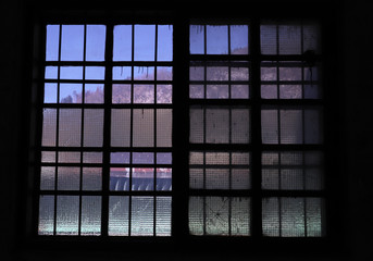 old damaged window in warehouse