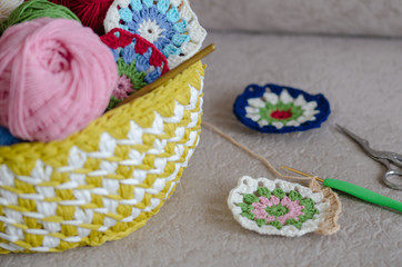 Multicolored plaid squares of crocheted and yarns,