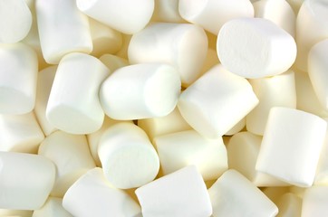 White marshmallows as background. Fluffy marshmallows texture.