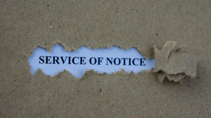 Torn paper with text service of notice