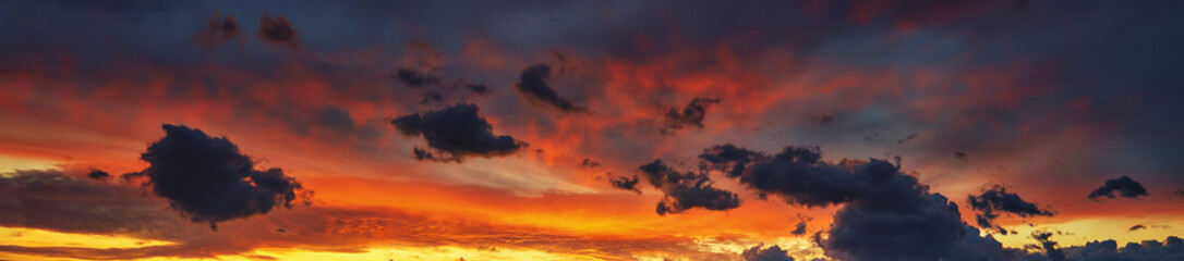 Colorful clouds on the dramatic sky. Panorama.