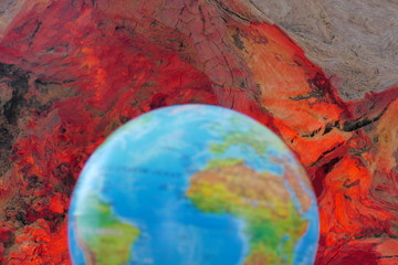 A Blurred Planet Earth Depiction, Showing a Global Wooden Surround of Red Hot Carbon.