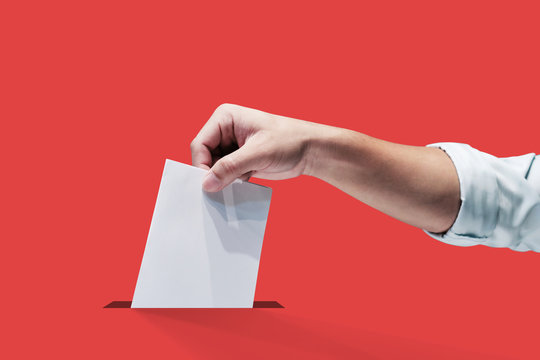 Hand holding ballot paper for election vote concept, clipping path Isolated.