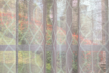 Abstract window curtain with flower garden closeup background