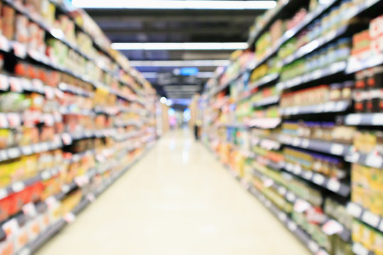 supermarket aisle interior with product shelves abstract blur background
