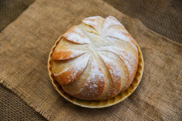 Fresh Bakery bread tray on the sack background homemade breakfast food concept - Round loaf of bread