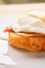 Breakfast is Eggs Benedict - toasted English muffins, bacon, ham, poached eggs, herbs and delicious buttery hollandaise sauce.