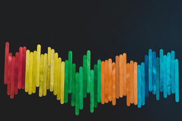Colorful sticks isolated on black background
