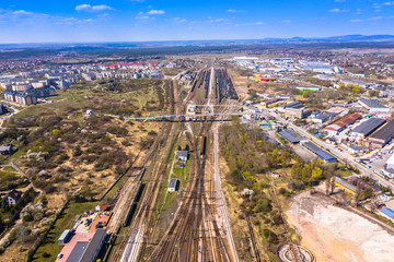 Cargo trains. Aerial view of colorful freight trains on the railway station. Wagons with goods on railroad.Aerial view