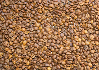 Cup of coffee beans, Scattered coffee beans around the cup