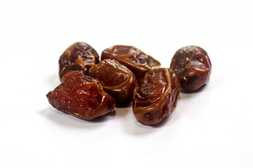 Kurma or dates fruits isolated on white background, Popular During Ramadhan or Fasting Month. Ramadhan food. Selective focus 