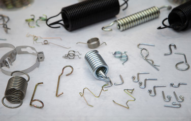 Various types of flexible compression, tension and torsion springs. Industrial manufacturing