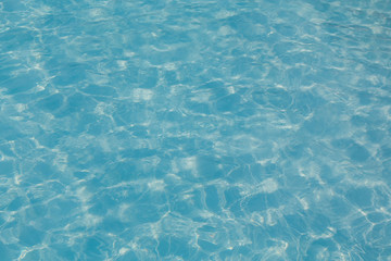 Obraz premium Blue pool water with sun reflection