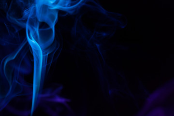 Colorful smoke close-up on a black background