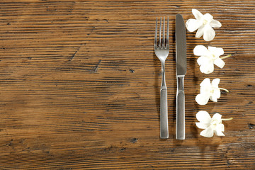 Fresh flowers and kitchen desk with fork 
