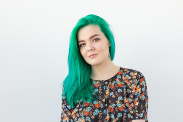 Fashion, hair coloring and people concept - Portrait of beautiful girl with green hair on a white background