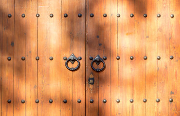 old wooden door with iron knockers
