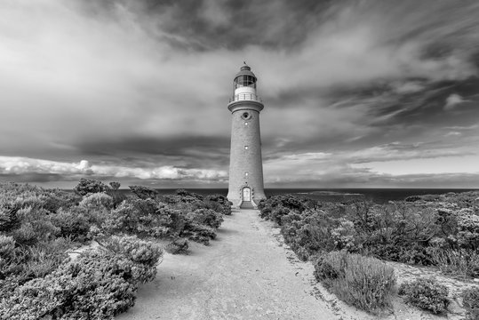 The beautiful Cape du Couedic Lighthouse in black and white on a day with dramatic sky, Kangaroo Island, Southern Australia