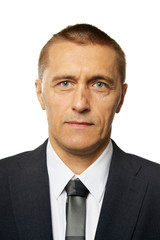 Portrait of a businessman wearing formal suit posing isolated