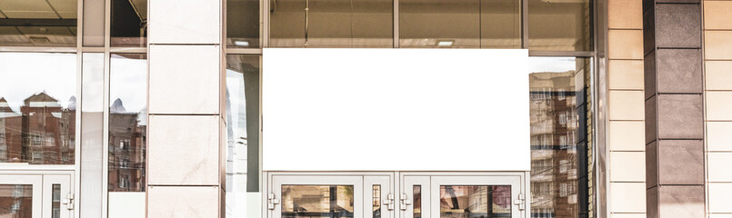 Signboard front view, empty white mock up. Photo blank signboard on the street