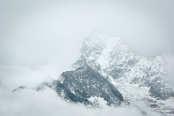 Fototapeta na wymiar Everest trekking. The mountains are covered with clouds. Nepal.