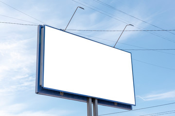 Billboard on the background of a beautiful blue cloudy sky. Mock up for your advertising or announcements