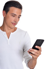 Handsome young man in white clothing using smartphone posing on white background