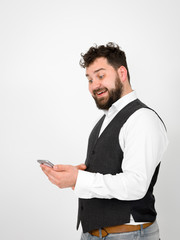 young man with black beard is posing and looking at his smartphone in front of white background with different emotions