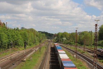Fototapeta na wymiar Departure of a container freight train from above