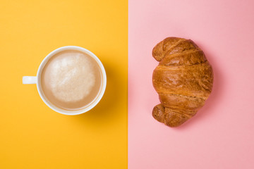 Breakfast coffee with croissants on a pink and yellow background