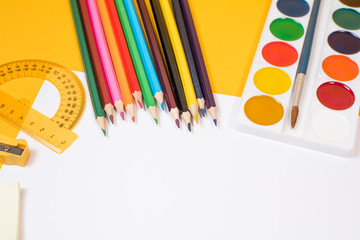 Back to school. Children's creativity. Colored pencils, felt-tip pens, brushes and paints, scissors...