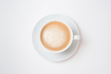 Breakfast coffee on a white background. Latte on a saucer