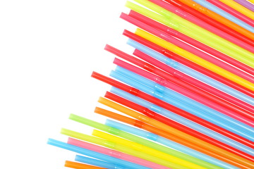 Colorful drinking straws isolated on white background, top view