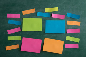 Colorful sticky notes on the blank blackboard