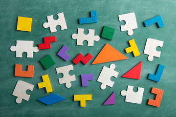 Creative solution for idea - business concept, jigsaw puzzle on the blackboard