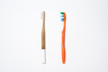  Life style zero waste. Reduced use of plastic packaging. Replacing a plastic toothbrush with a wooden toothbrush. White background