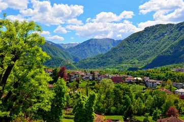panoramic views of mountains, houses and clouds
