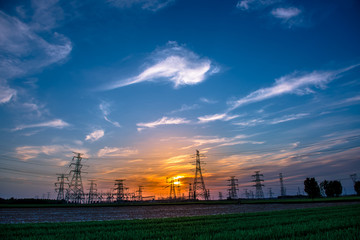 Silhouette of Power Supply Facilities at Sunset
