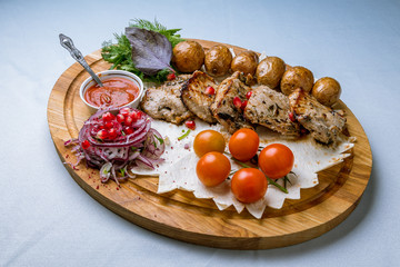 Kebab of veal on board