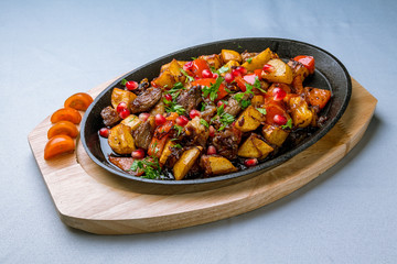 Roast beef and vegetables and potatoes fried