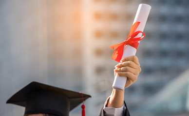 graduation certificate in her hand