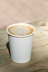 mug from a cappuccino on a wooden table