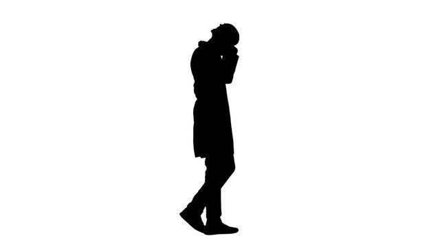 Silhouette Arabic doctor walking and putting medical cap on.