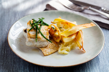 Sea bass fillet with parsnip crisp and samphire 