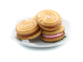 sandwich cookies with strawberry cream on white background
