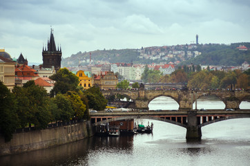 Scenic spring view of the Old Town pier architecture and Charles Bridge over Vltava river in...